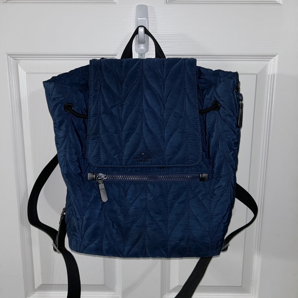 Navy blue quilted large Kate Spade backpack. In beautiful condition.